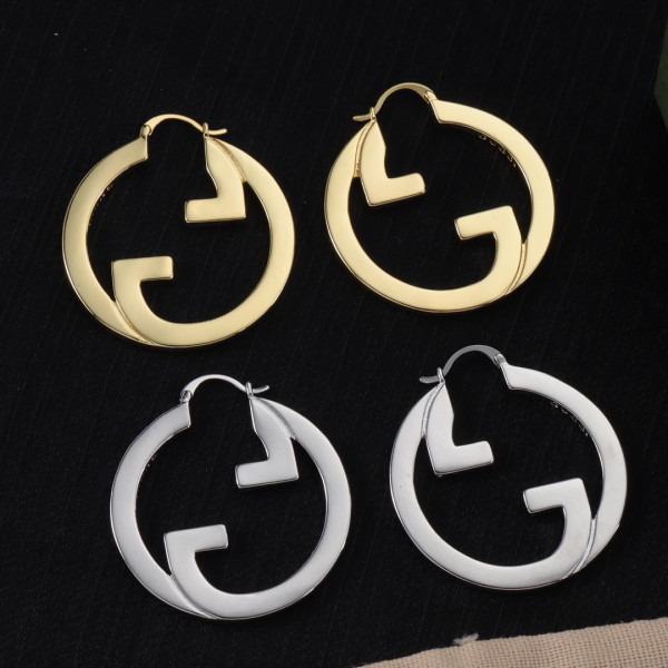 G*u*i earrings