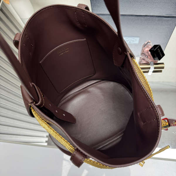 Pra*a buckle leather bucket bag with jeweled belt